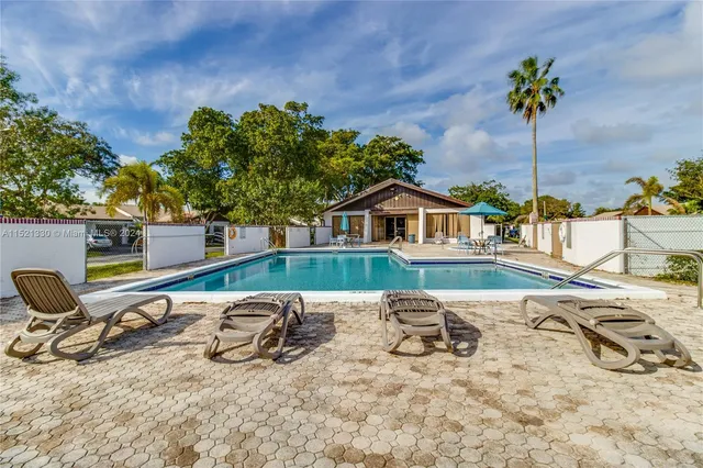 a view of a lounge chair and table in the house
