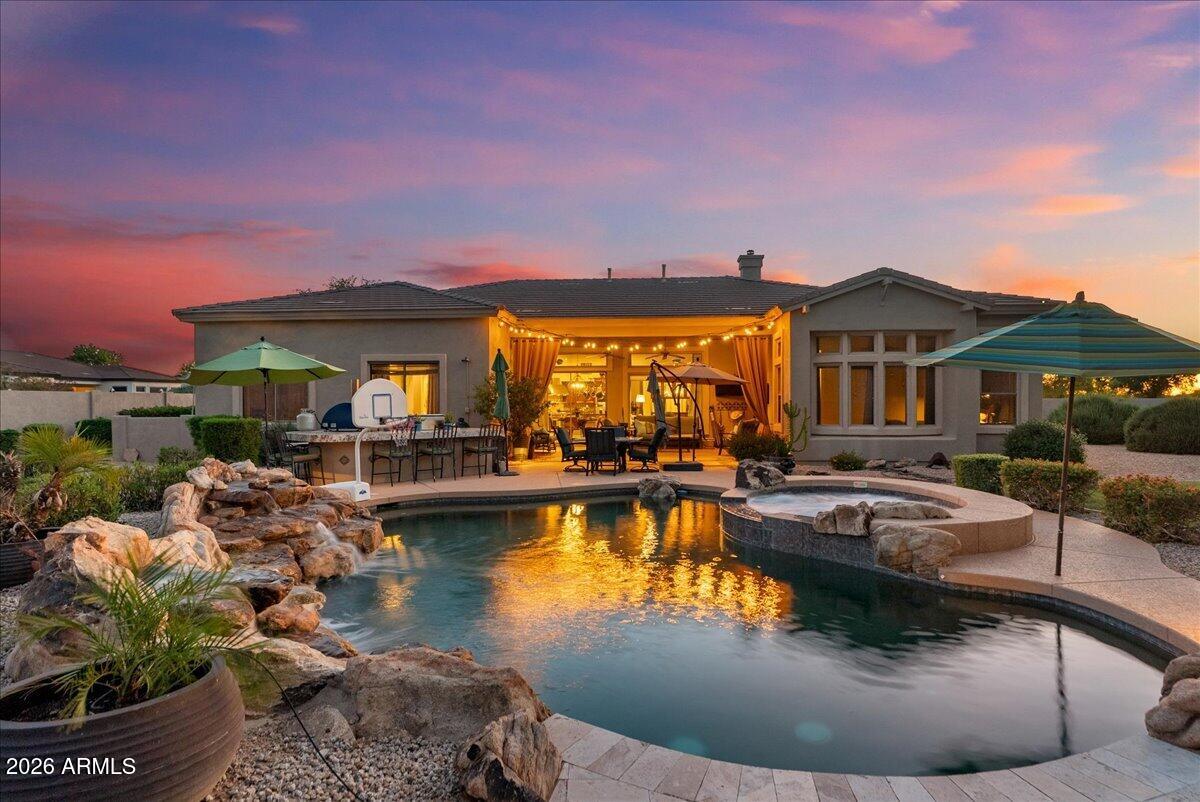 6427 South Magic Court Gilbert, AZ 85298 - Photo 59 of 71 a view of a swimming pool with outdoor seating