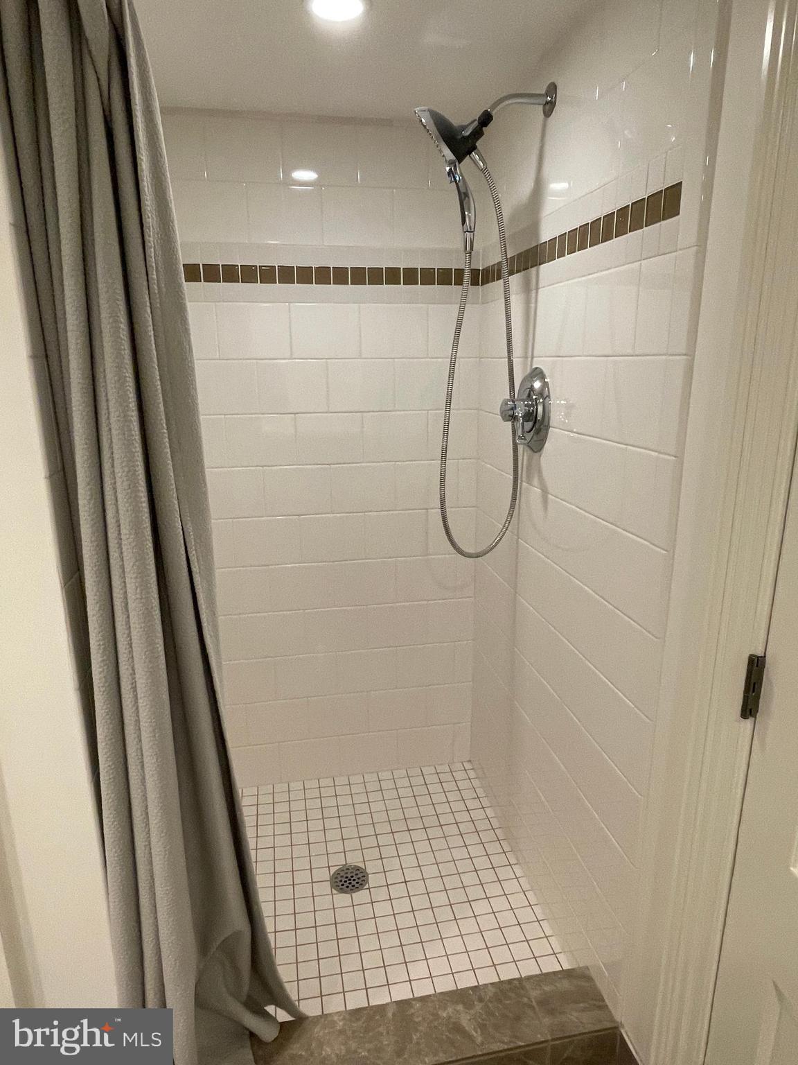 2802 P Street Northwest Washington, DC 20007 - Photo 38 of 58 a bathroom with a glass shower door