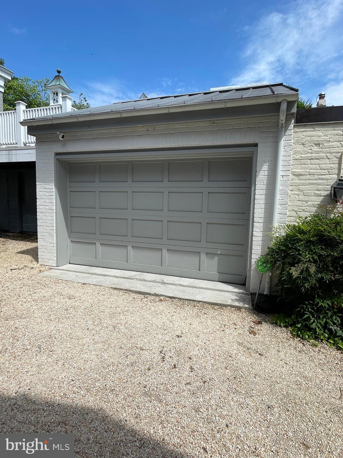 2802 P Street Northwest Washington, DC 20007 - Photo 4 of 58 a front view of a house with a yard and garage