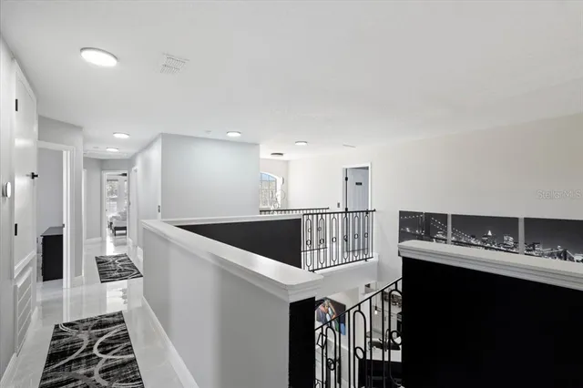 a kitchen with stainless steel appliances granite countertop a refrigerator and a stove