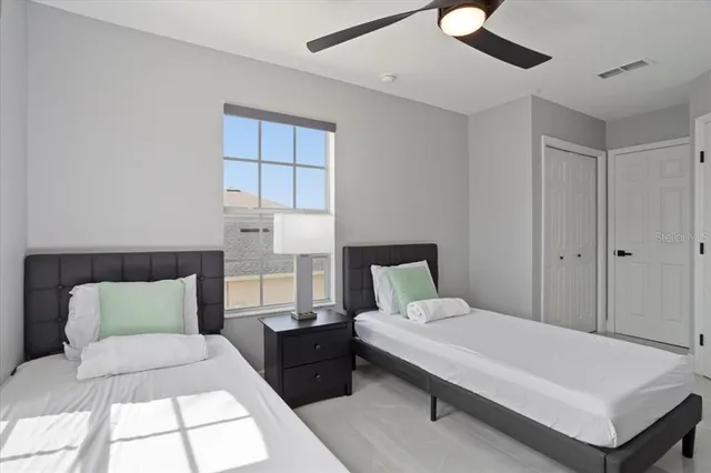 a bedroom with a bed and a window