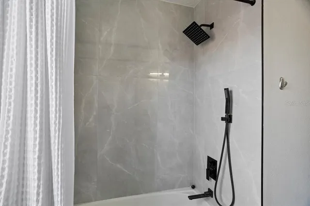 a bathroom with a sink a mirror and a window