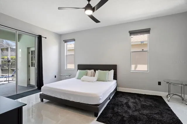 a bathroom with a double vanity sink mirror and bathtub