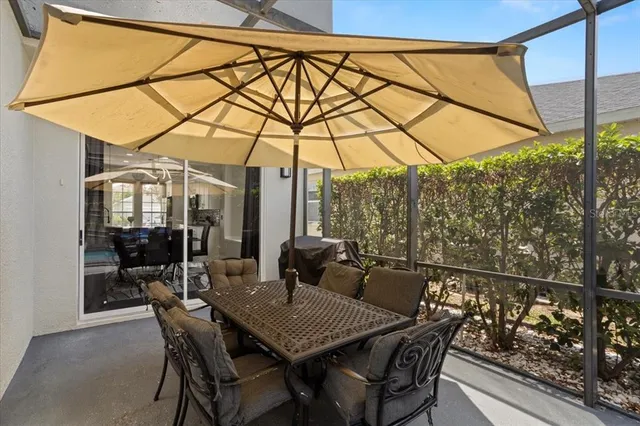 a view of a porch with furniture and a yard