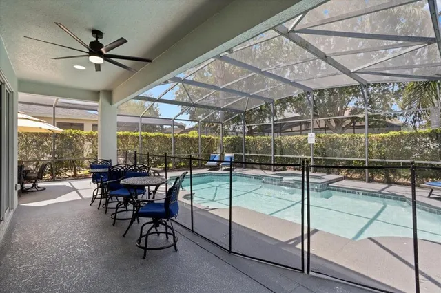 a view of a swimming pool with a patio