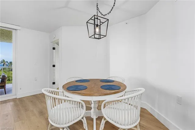 a living room with furniture potted plant and a rug