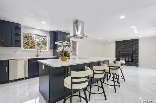 a kitchen with a sink and refrigerator