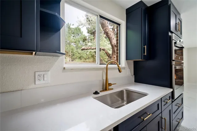 a bedroom with a bed and a potted plant