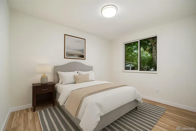 a balcony with furniture and a large window