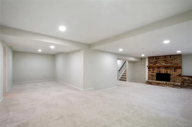 a backyard of a house with plants and tree