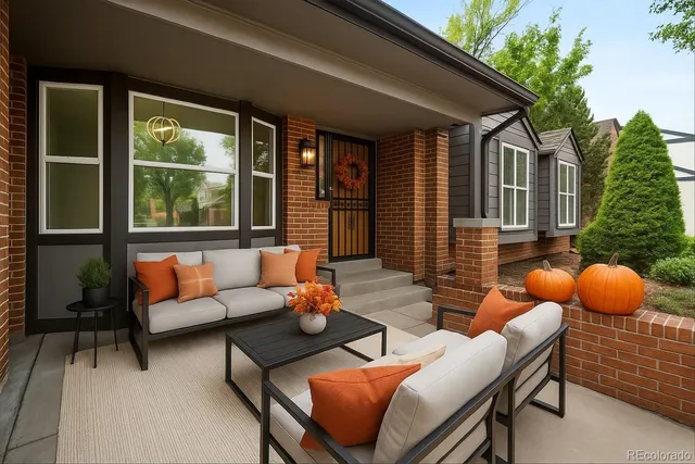 a outdoor living space with patio furniture and garden view