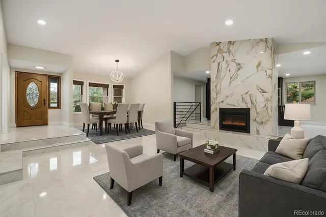 a living room with furniture couches and a fireplace