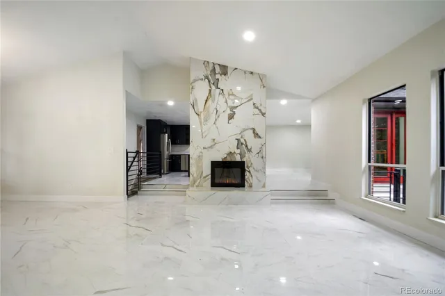 a kitchen with stainless steel appliances a sink and a refrigerator