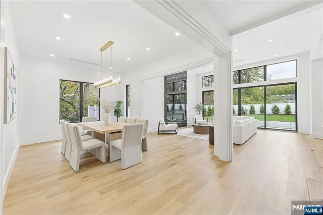 a bathroom with a granite countertop sink mirror bathtub and shower
