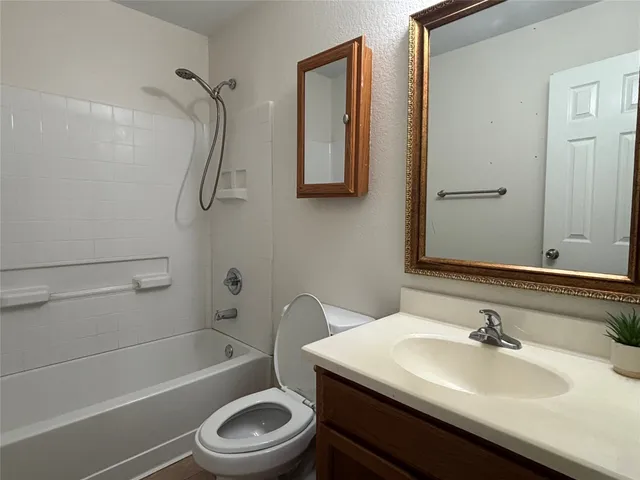a bathroom with a sink a toilet and a bathtub
