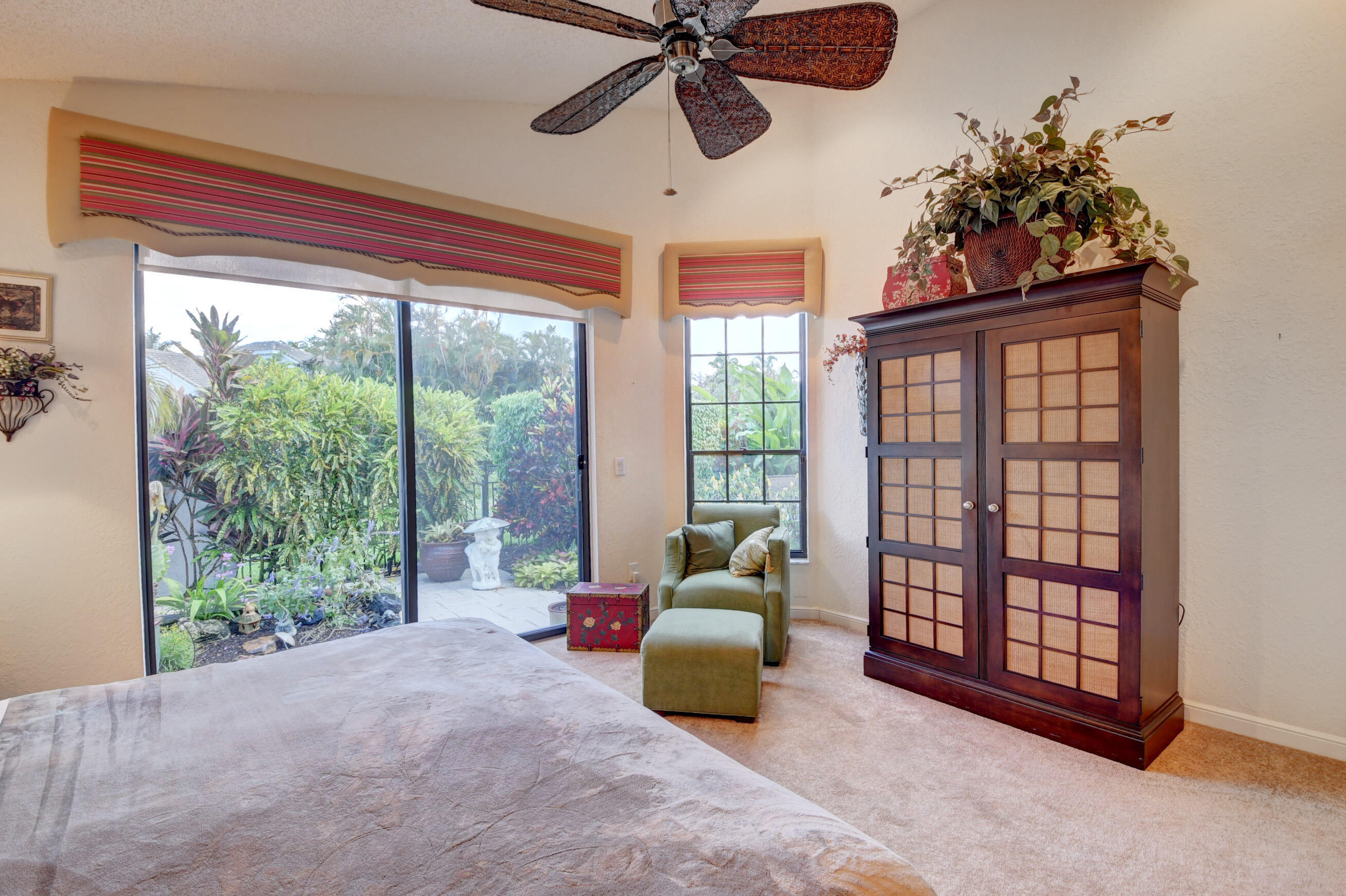2187 Northwest 59th Street Boca Raton, FL 33496 - Photo 19 of 45 a bed room with a bed and a large window