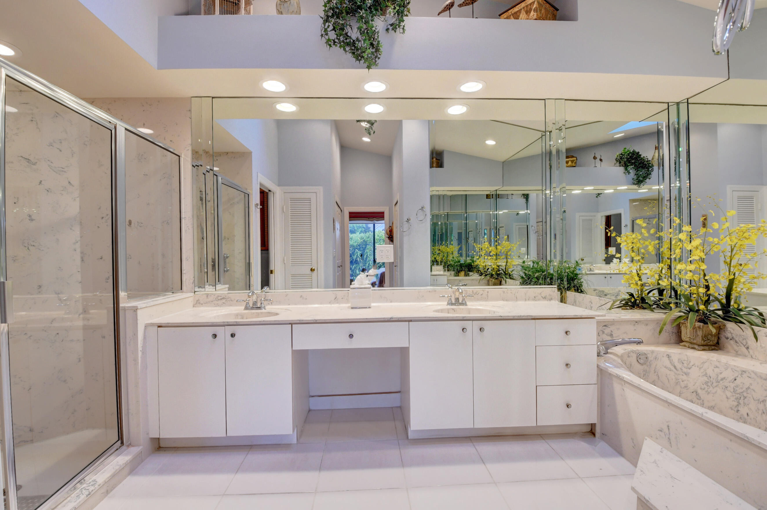 2187 Northwest 59th Street Boca Raton, FL 33496 - Photo 21 of 45 a large white kitchen with a sink and cabinets