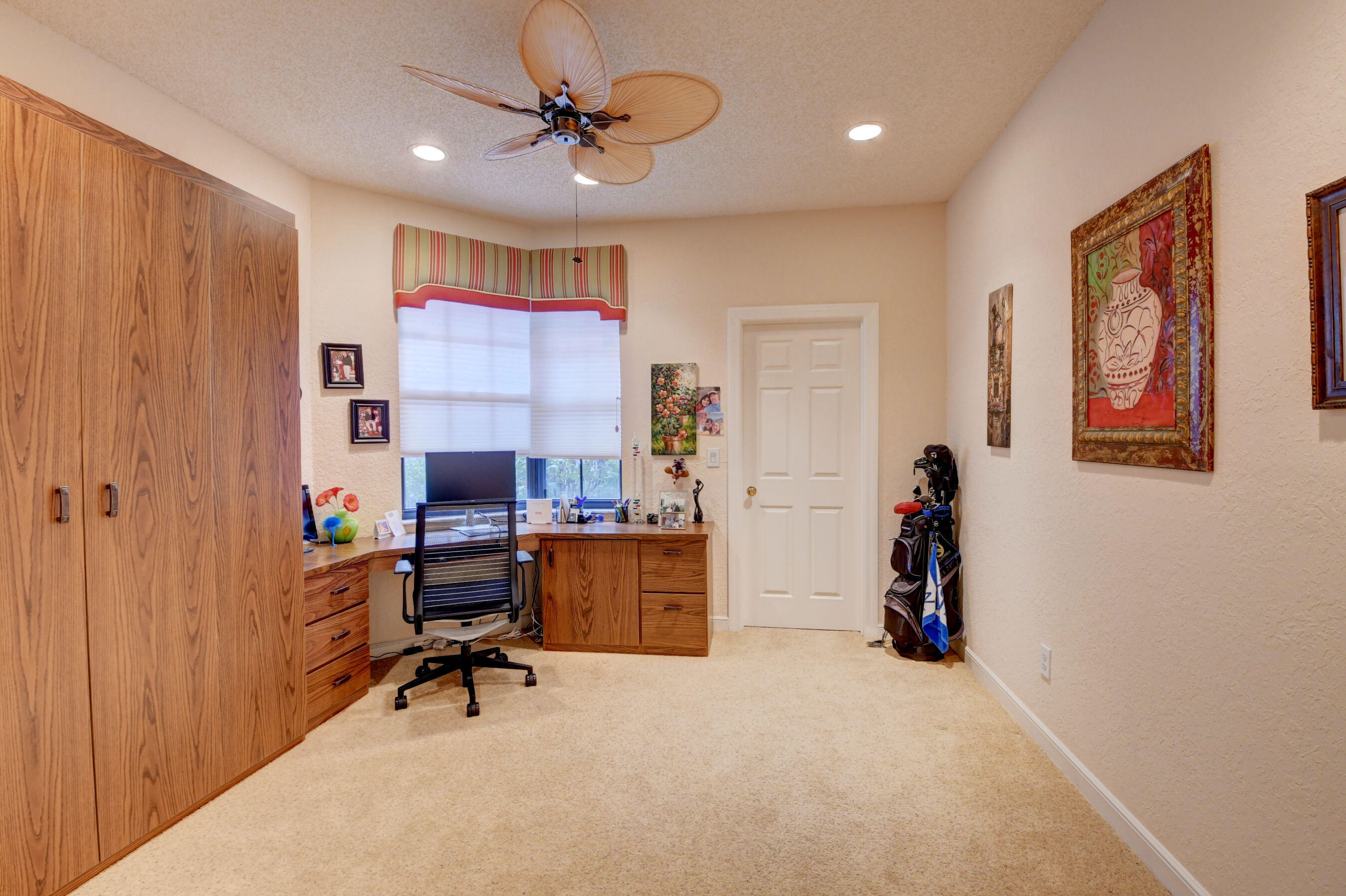 2187 Northwest 59th Street Boca Raton, FL 33496 - Photo 22 of 45 a view of a workspace with furniture and a window
