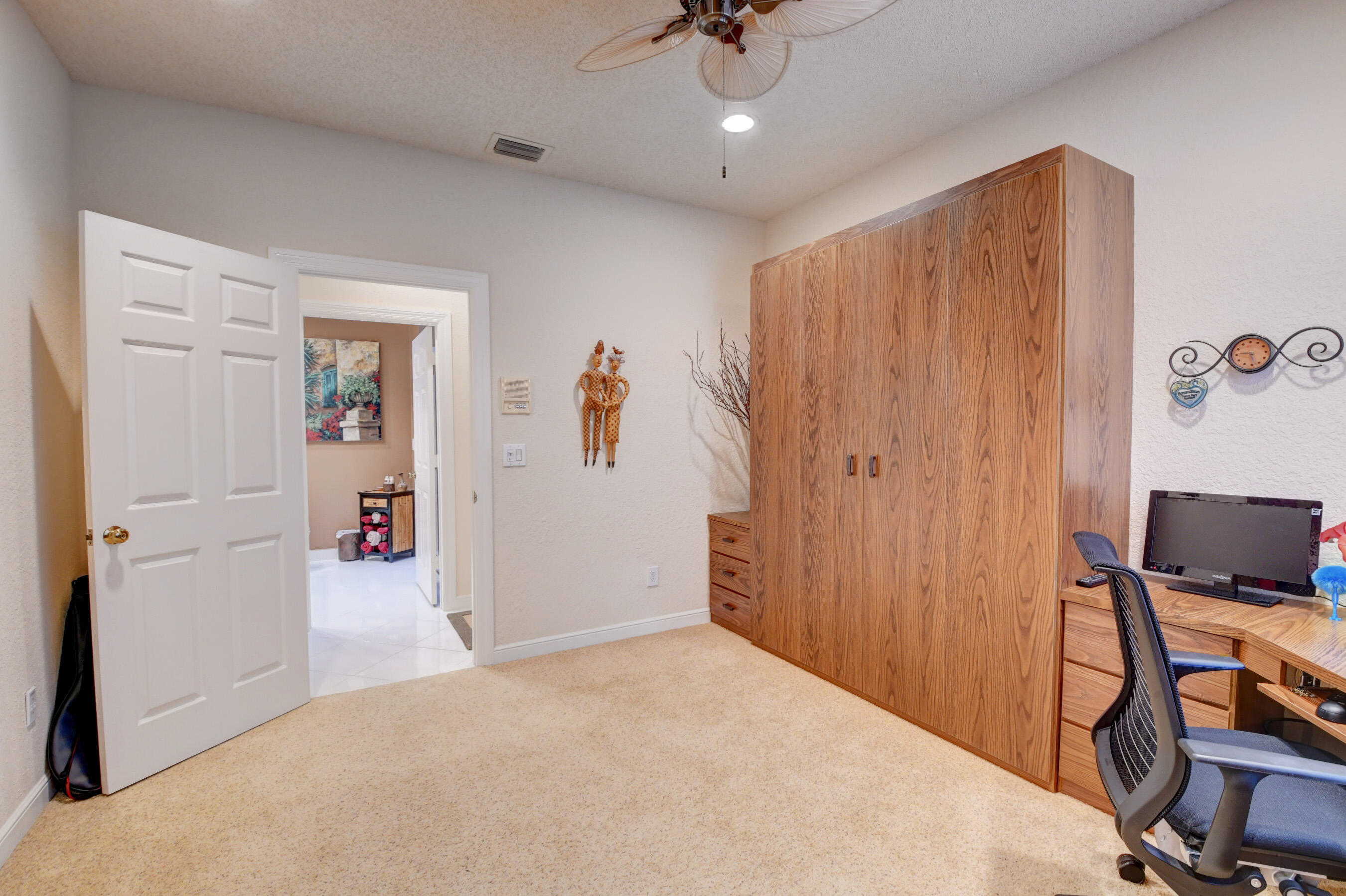 2187 Northwest 59th Street Boca Raton, FL 33496 - Photo 23 of 45 a view of a livingroom with an empty space and a bedroom