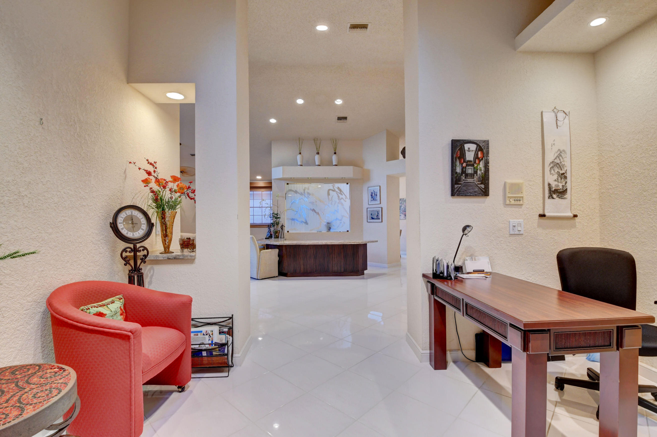2187 Northwest 59th Street Boca Raton, FL 33496 - Photo 26 of 45 a living room with furniture and a mirror
