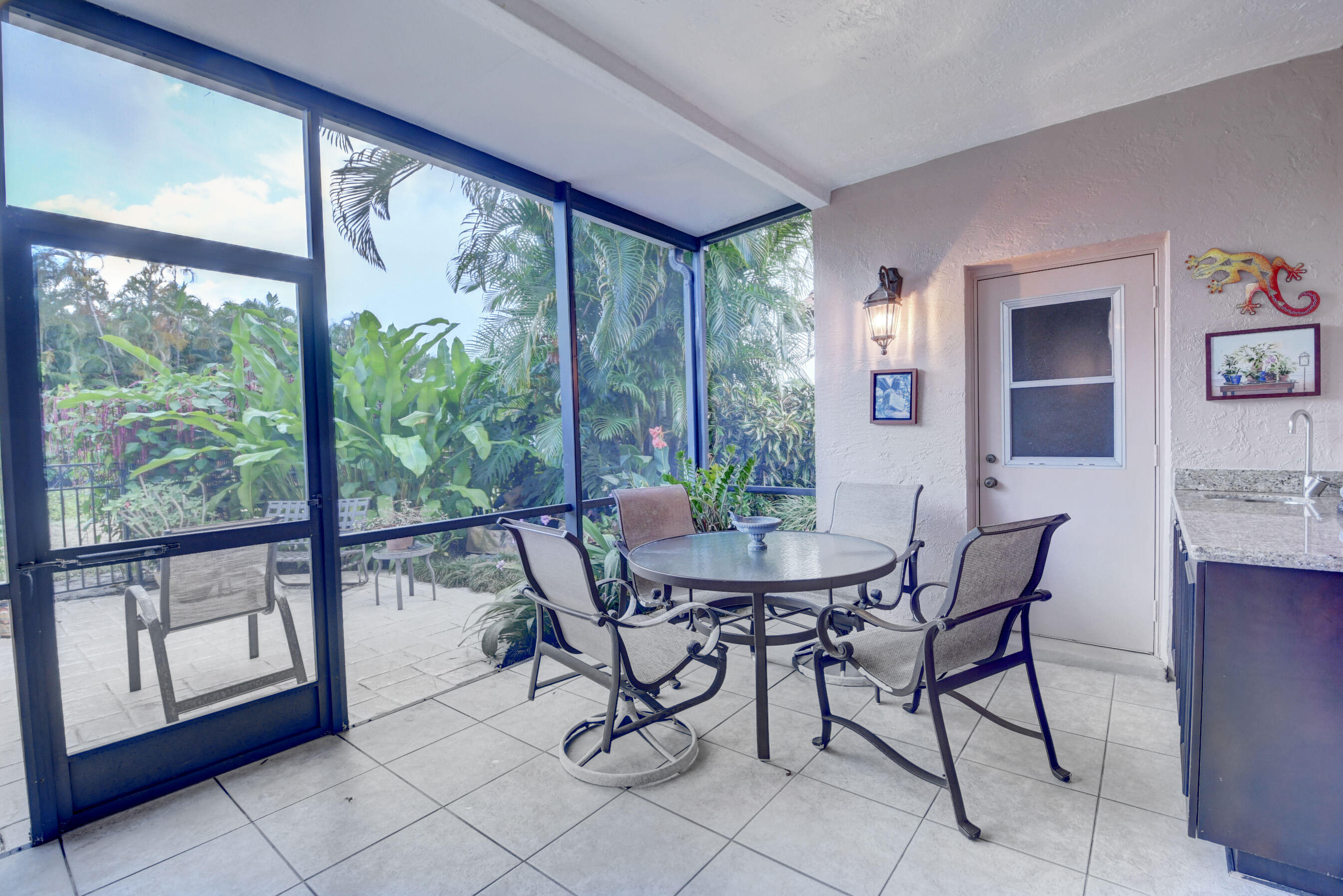 2187 Northwest 59th Street Boca Raton, FL 33496 - Photo 27 of 45 a view of a dining room with furniture window and outside view