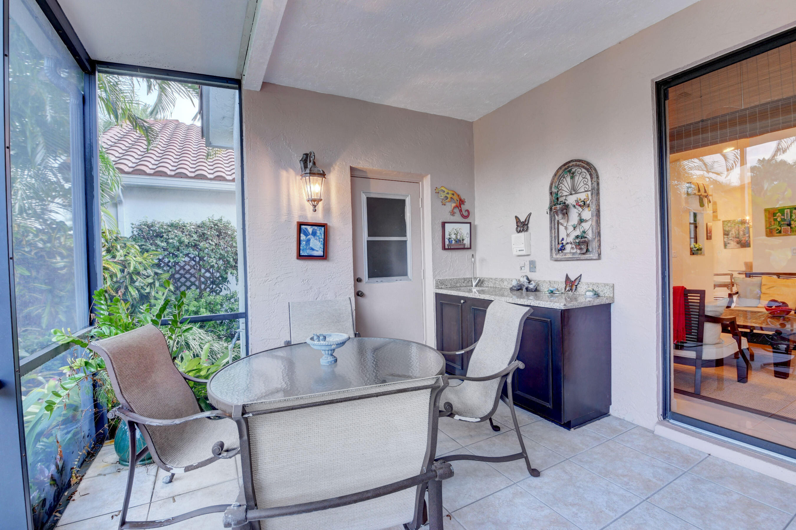 2187 Northwest 59th Street Boca Raton, FL 33496 - Photo 28 of 45 a dining room with furniture and window or wooden floor
