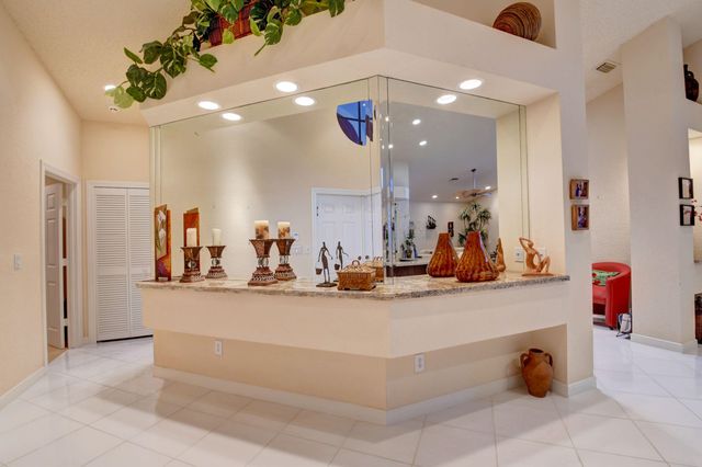 a view of gym equipment and kitchen view