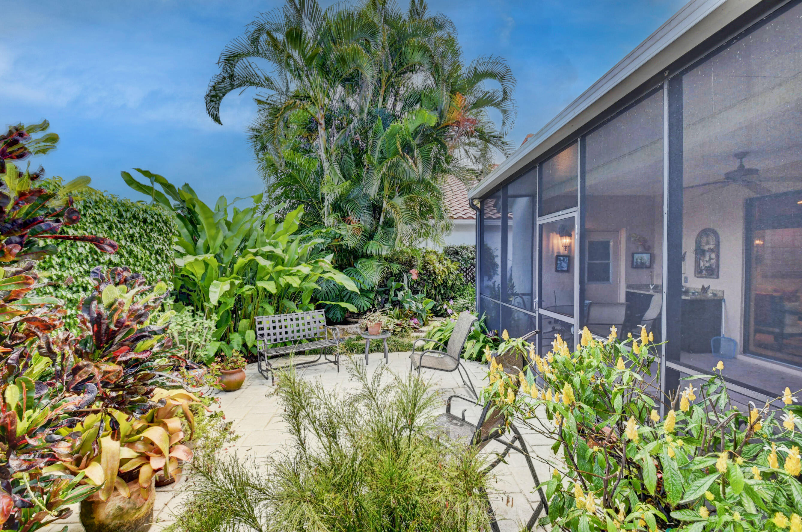 2187 Northwest 59th Street Boca Raton, FL 33496 - Photo 33 of 45 a plant that is in front of a house