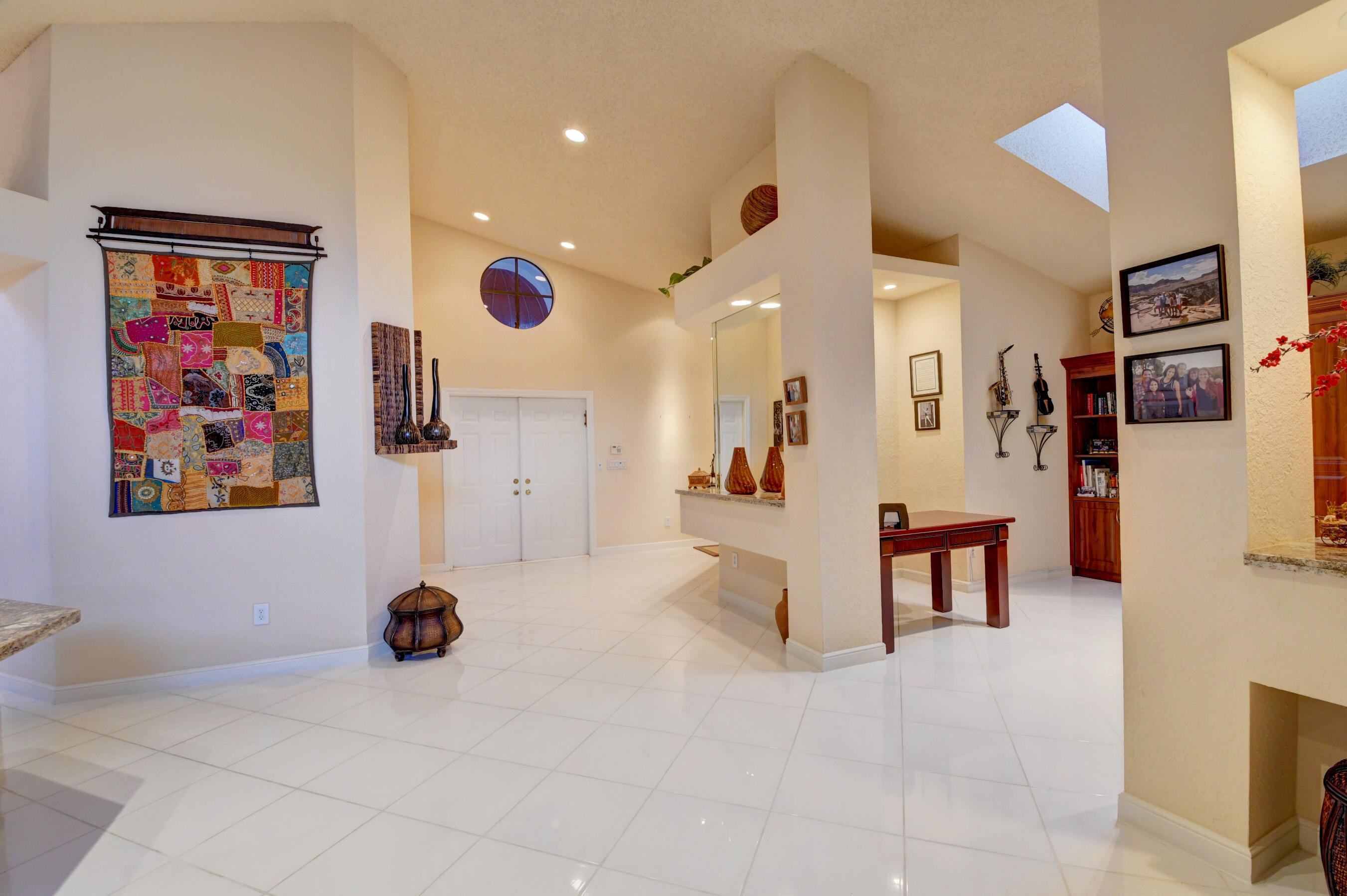 2187 Northwest 59th Street Boca Raton, FL 33496 - Photo 7 of 45 a view of a livingroom with furniture and a flat screen tv
