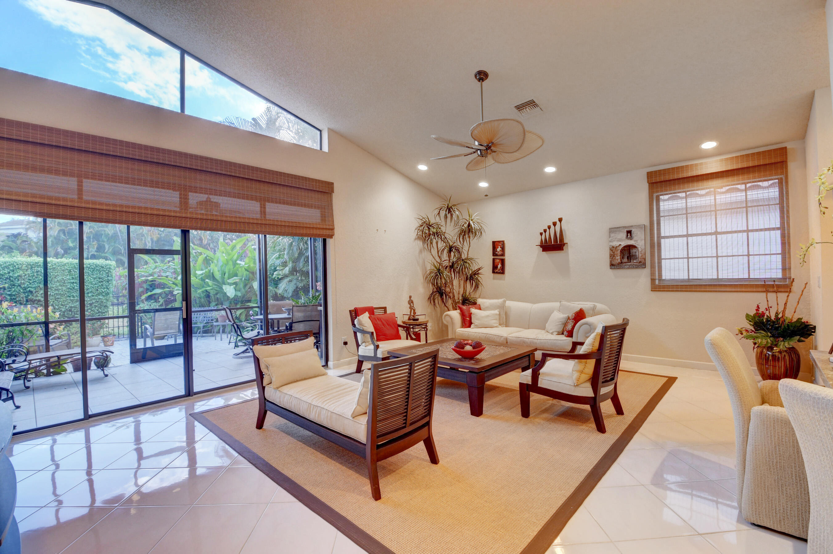2187 Northwest 59th Street Boca Raton, FL 33496 - Photo 8 of 45 a living room with furniture and a large window