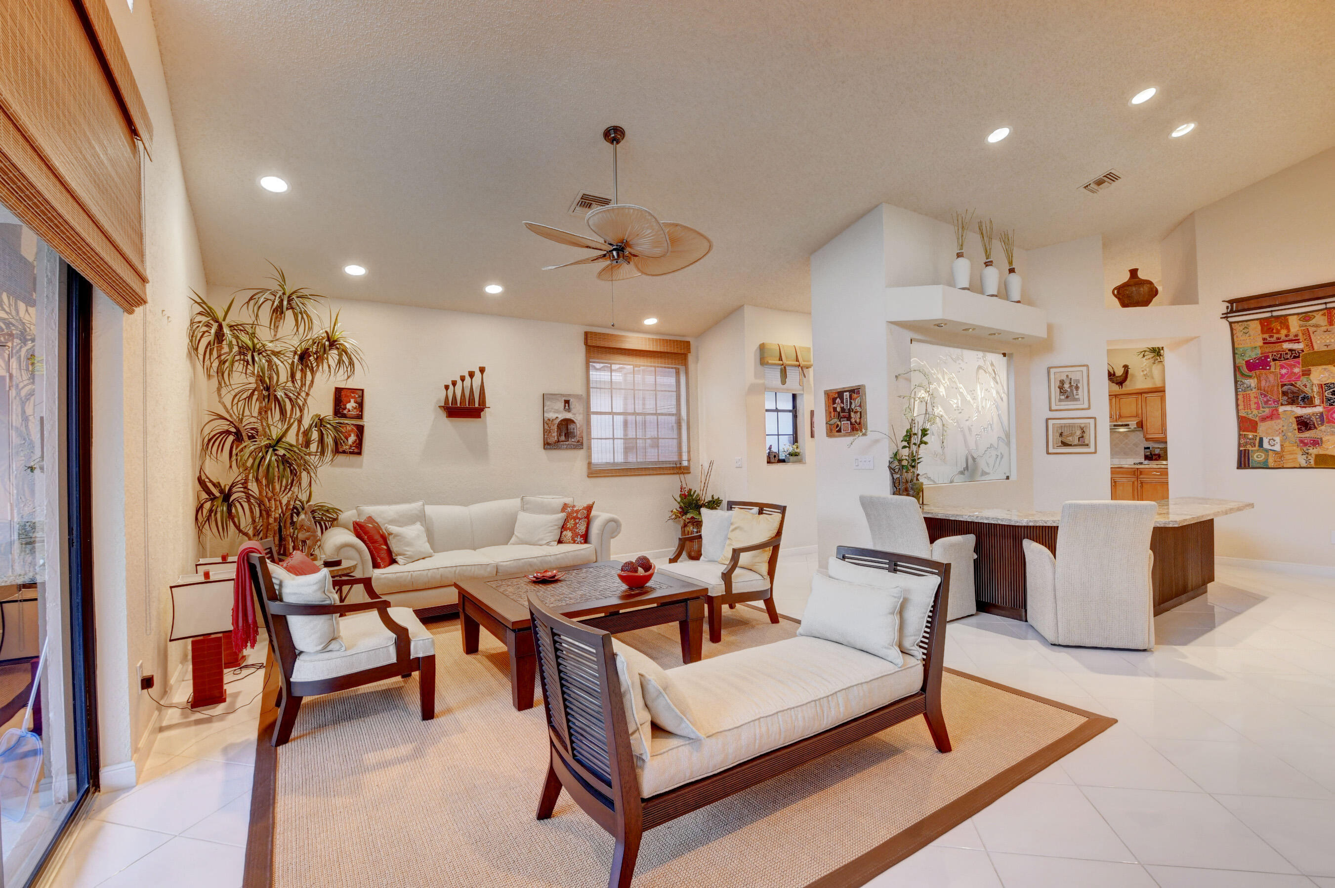 2187 Northwest 59th Street Boca Raton, FL 33496 - Photo 9 of 45 a living room with furniture and a chandelier