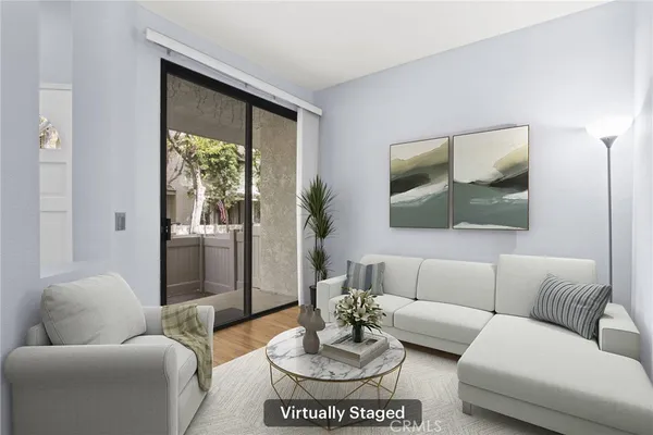 a living room with furniture and a large window