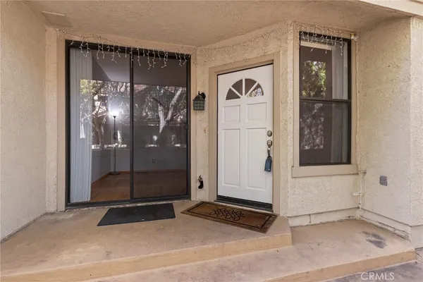 a view of front door with a glass door shower