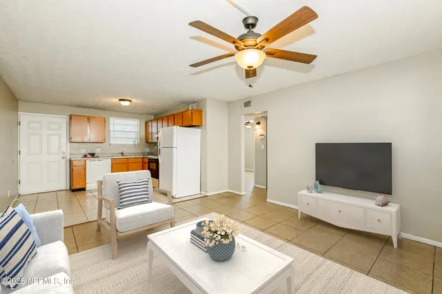 a kitchen with stainless steel appliances granite countertop a refrigerator sink and cabinets