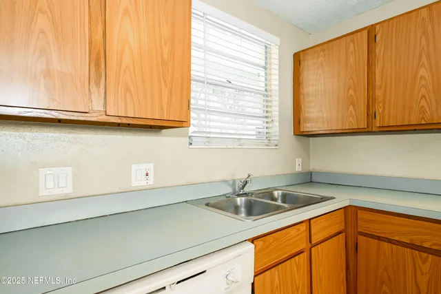 a bedroom with a bed and a ceiling fan