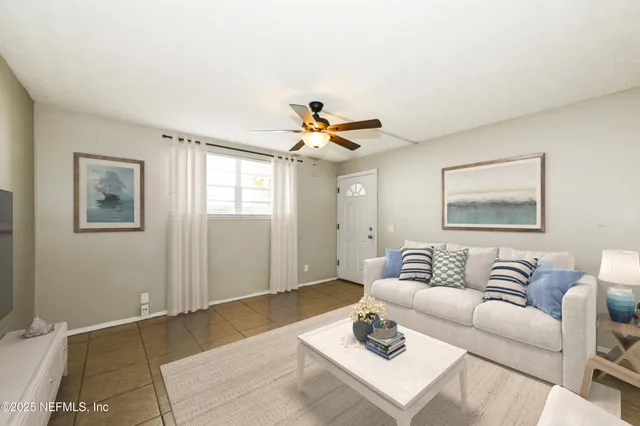 a living room with furniture and window