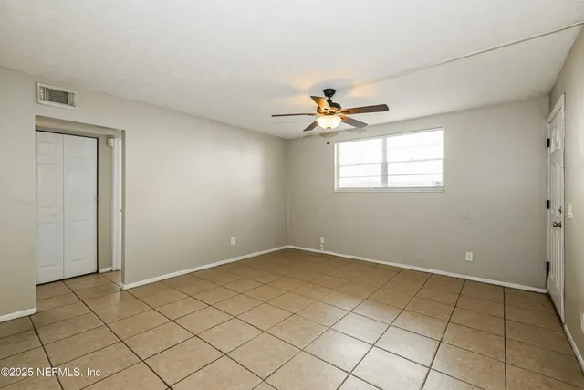 a view of an empty room with a window