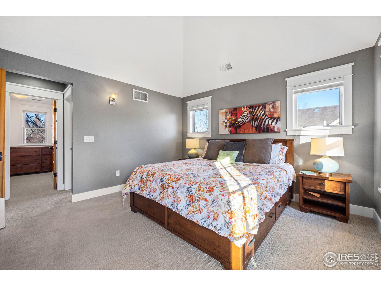 1780 Baseline Road Boulder, CO 80302 - Photo 19 of 31 a bed room with a bed and a painting on the wall