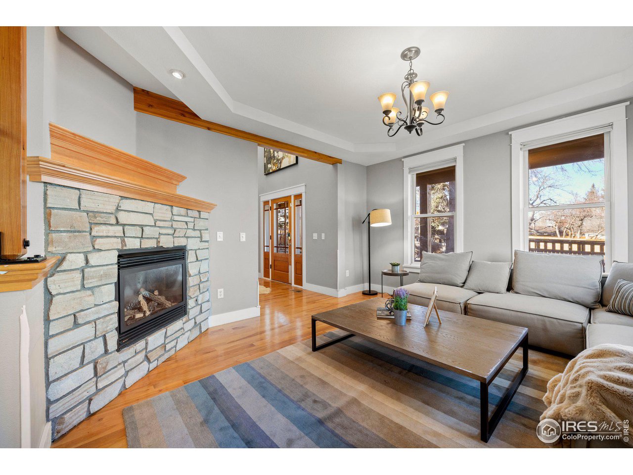 1780 Baseline Road Boulder, CO 80302 - Photo 6 of 31 a living room with furniture a fireplace and a large window