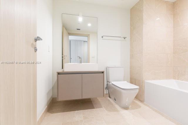 1000 Brickell Plaza, Unit 4015 Miami, FL 33131 - Photo 14 of 29 a bathroom with a sink toilet and shower