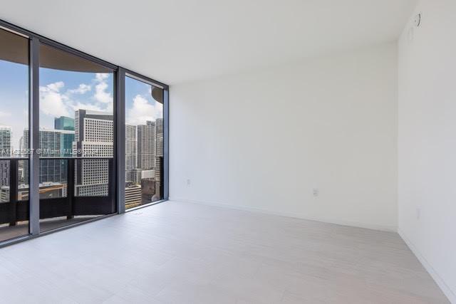 1000 Brickell Plaza, Unit 4015 Miami, FL 33131 - Photo 20 of 29 a view of an empty room with sliding glass door
