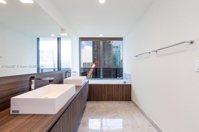 1000 Brickell Plaza, Unit 4015 Miami, FL 33131 - Photo 22 of 29 a living room with furniture and large windows