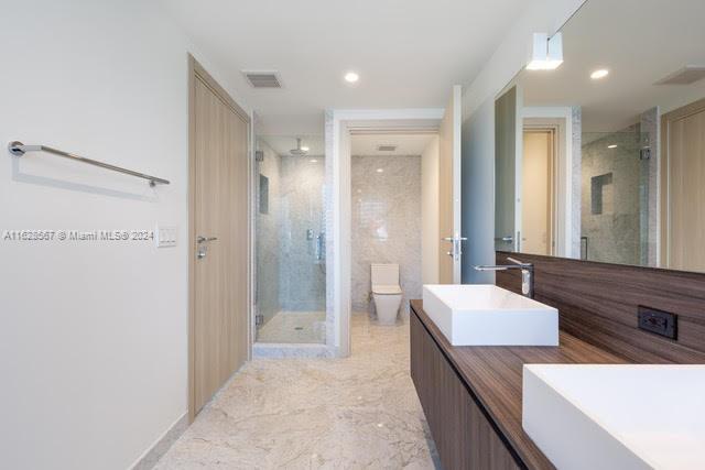 1000 Brickell Plaza, Unit 4015 Miami, FL 33131 - Photo 24 of 29 a large bathroom with a double vanity sink mirror and shower