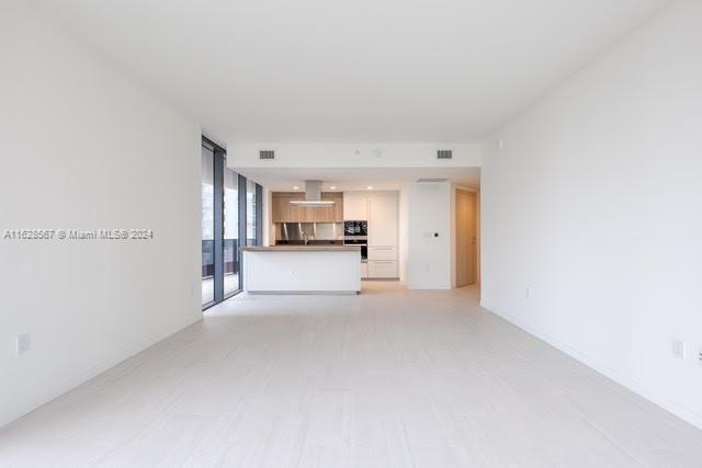 1000 Brickell Plaza, Unit 4015 Miami, FL 33131 - Photo 7 of 29 a view of a kitchen with a sink and cabinets