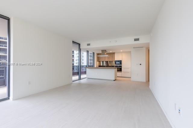 1000 Brickell Plaza, Unit 4015 Miami, FL 33131 - Photo 8 of 29 a view of a kitchen with refrigerator and a sink