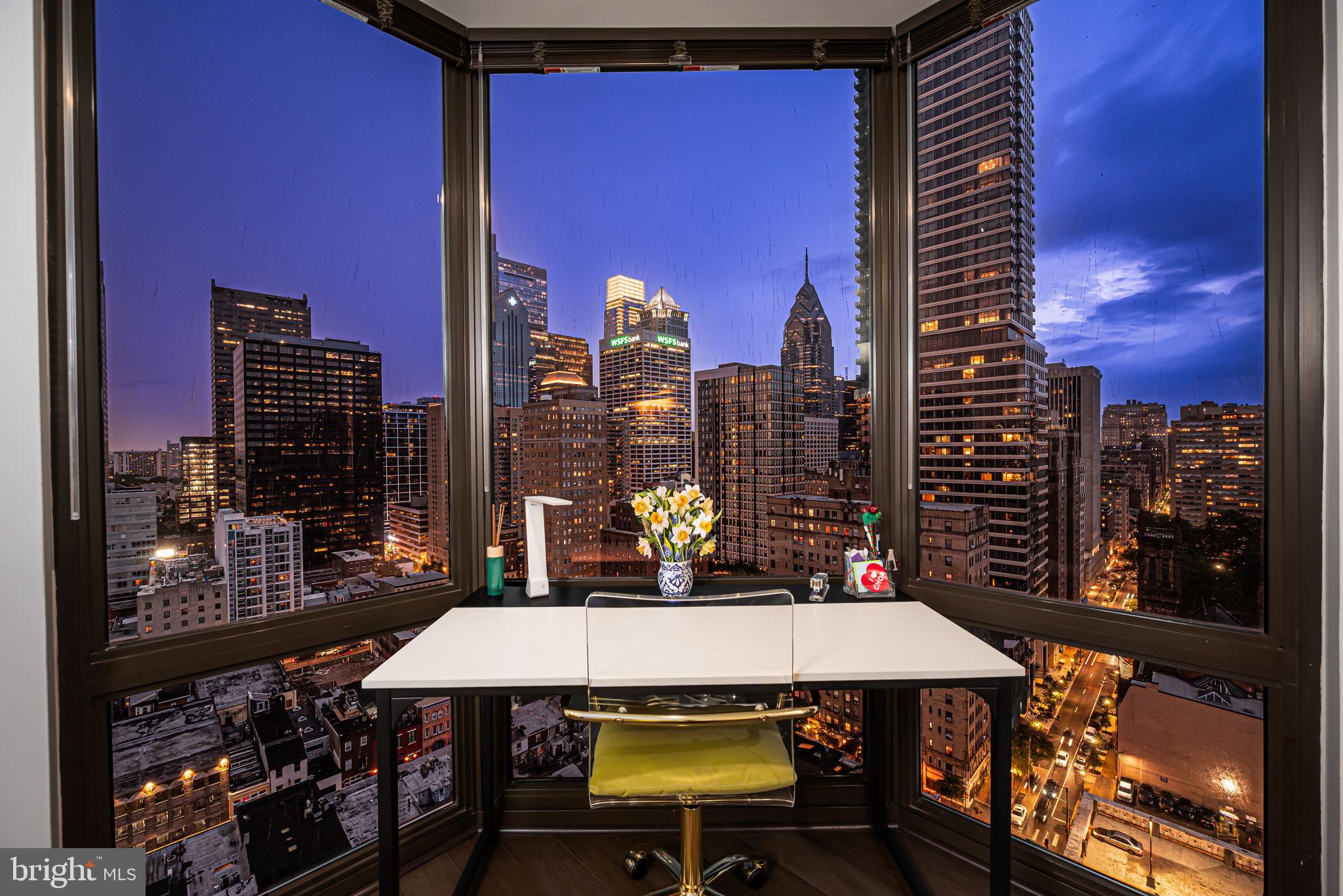 a view of a balcony with table and chairs
