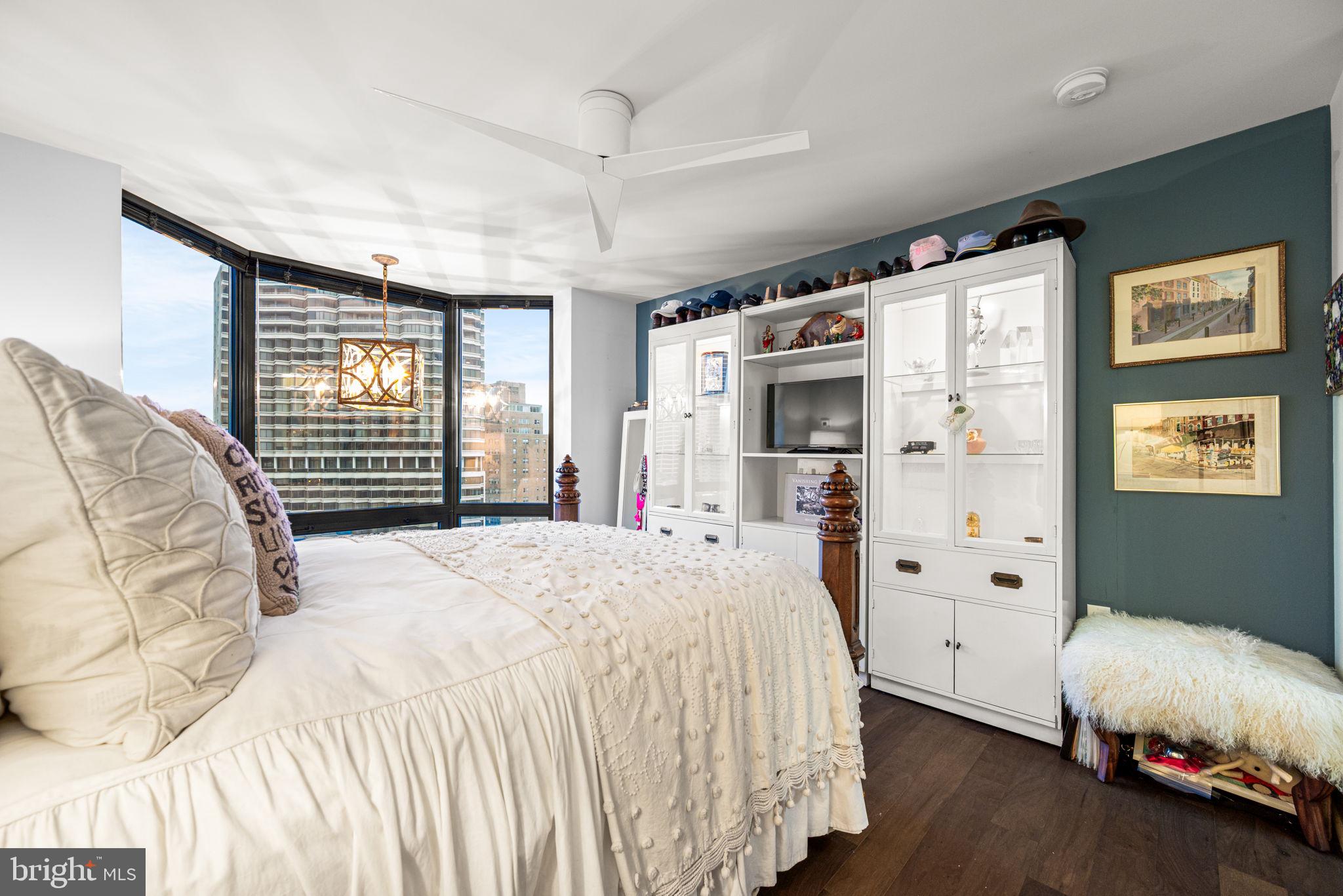 2020 Walnut Street, Unit 25B Philadelphia, PA 19103 - Photo 18 of 42 a spacious bedroom with a bed and a large window