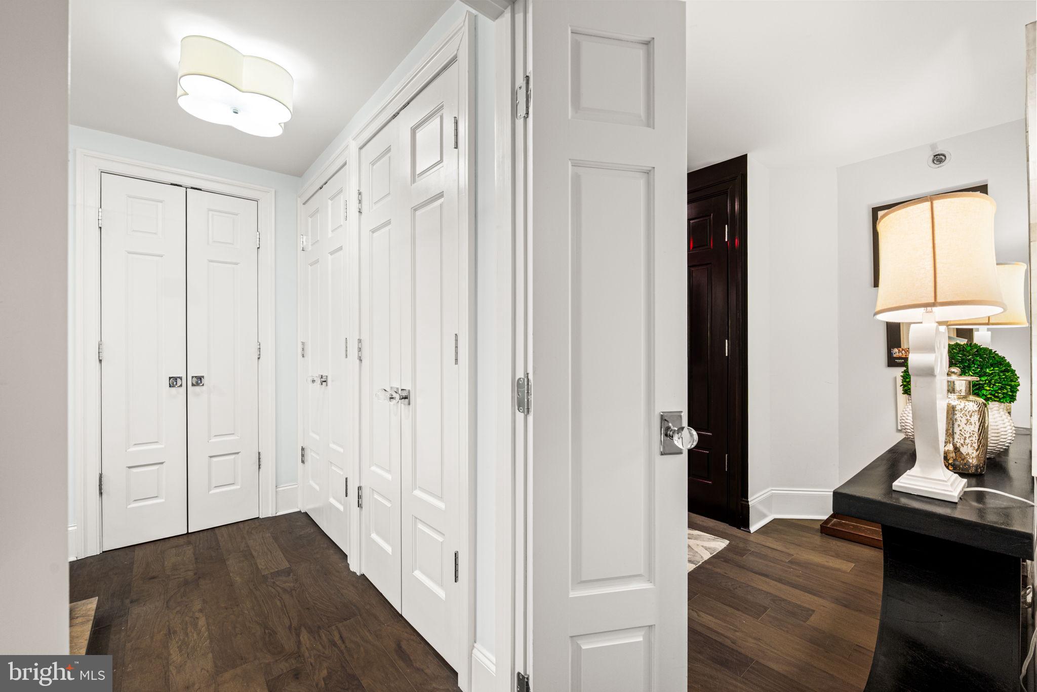 2020 Walnut Street, Unit 25B Philadelphia, PA 19103 - Photo 20 of 42 a view of a hallway with wooden floor and cabinet