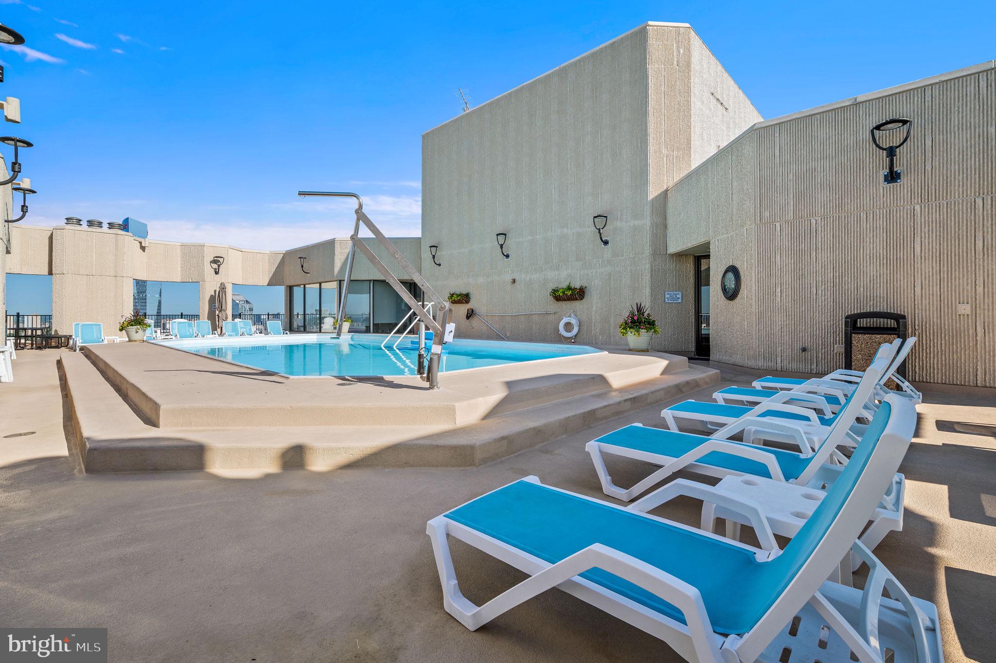 2020 Walnut Street, Unit 25B Philadelphia, PA 19103 - Photo 24 of 42 a swimming pool with outdoor seating and yard